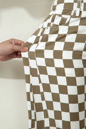 Maternity barrel pants in brown and white checkerboard cotton denim, showing pocket detail.