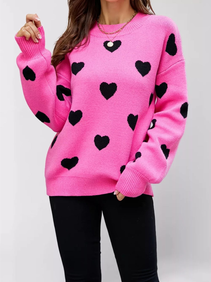 100% polyester Care instructions: Machine wash cold pullover sweater in Red Apricot with relaxed silhouette