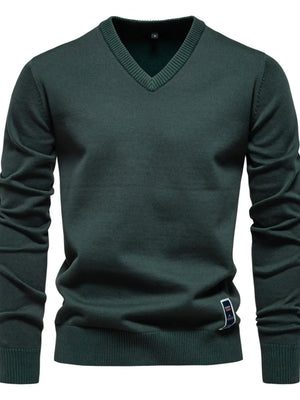 Essential V-neck ribbed knit sweater in Peacock Blue with a ribbed hem and cuffs.