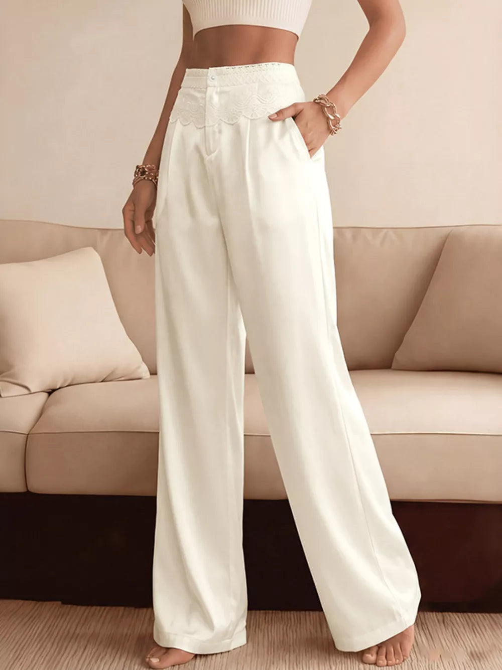 Lace-trimmed high-waist wide-leg pants in beige with pockets.