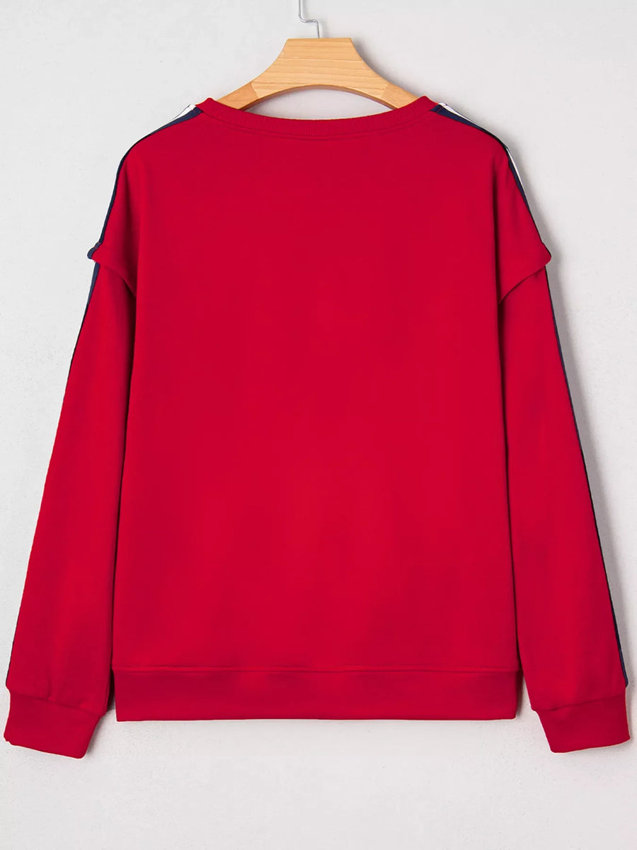Red sweatshirt with varsity stripe detail on sleeves and neckline