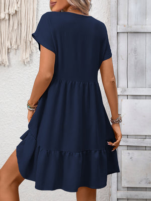Navy blue V-neck mini dress with short sleeves and a ruffled hem.