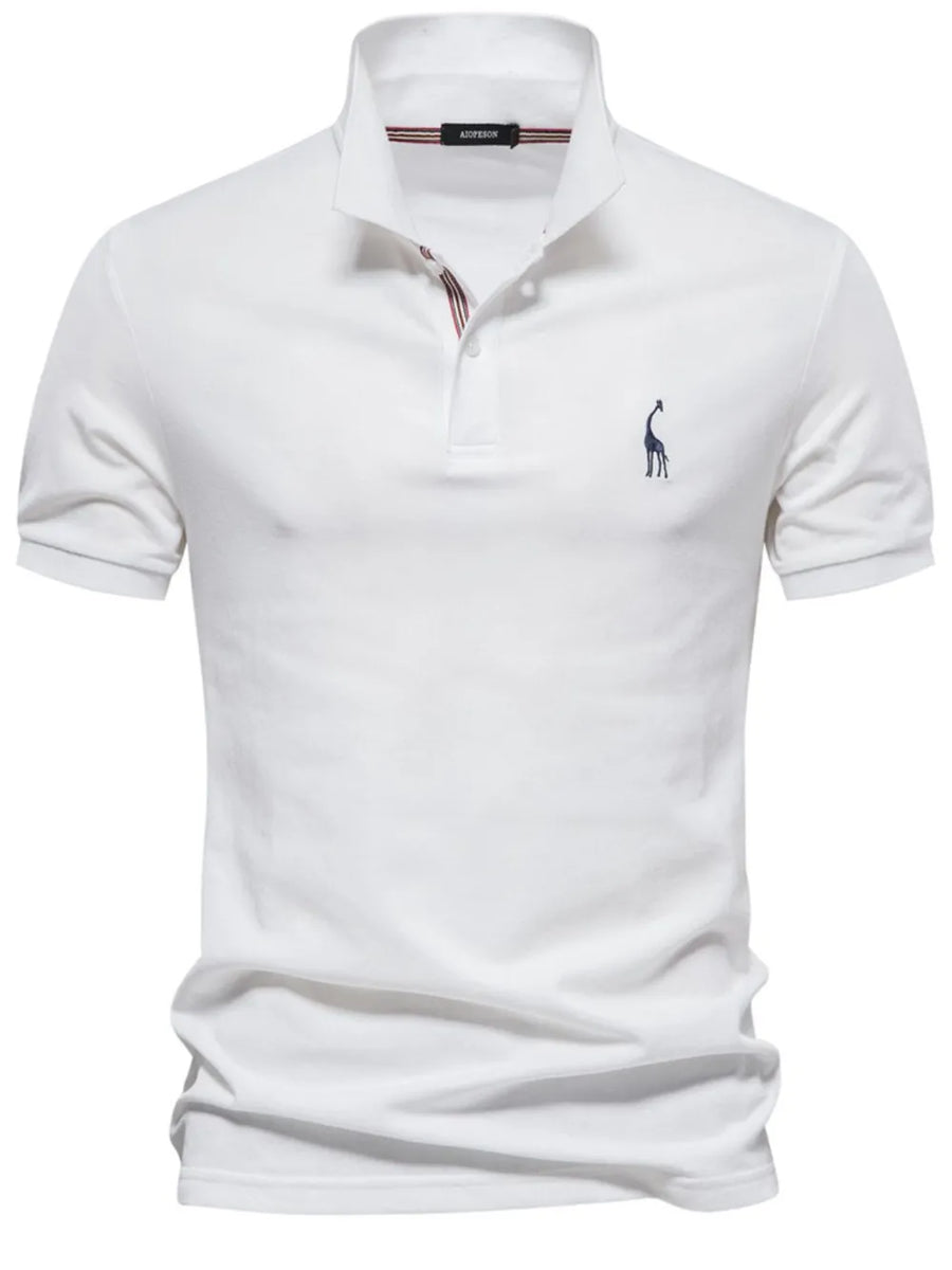 White piqué polo shirt with giraffe embroidery and striped collar detail.