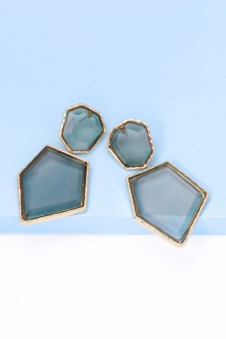 Resin facet drop earrings with gold trim in light blue.