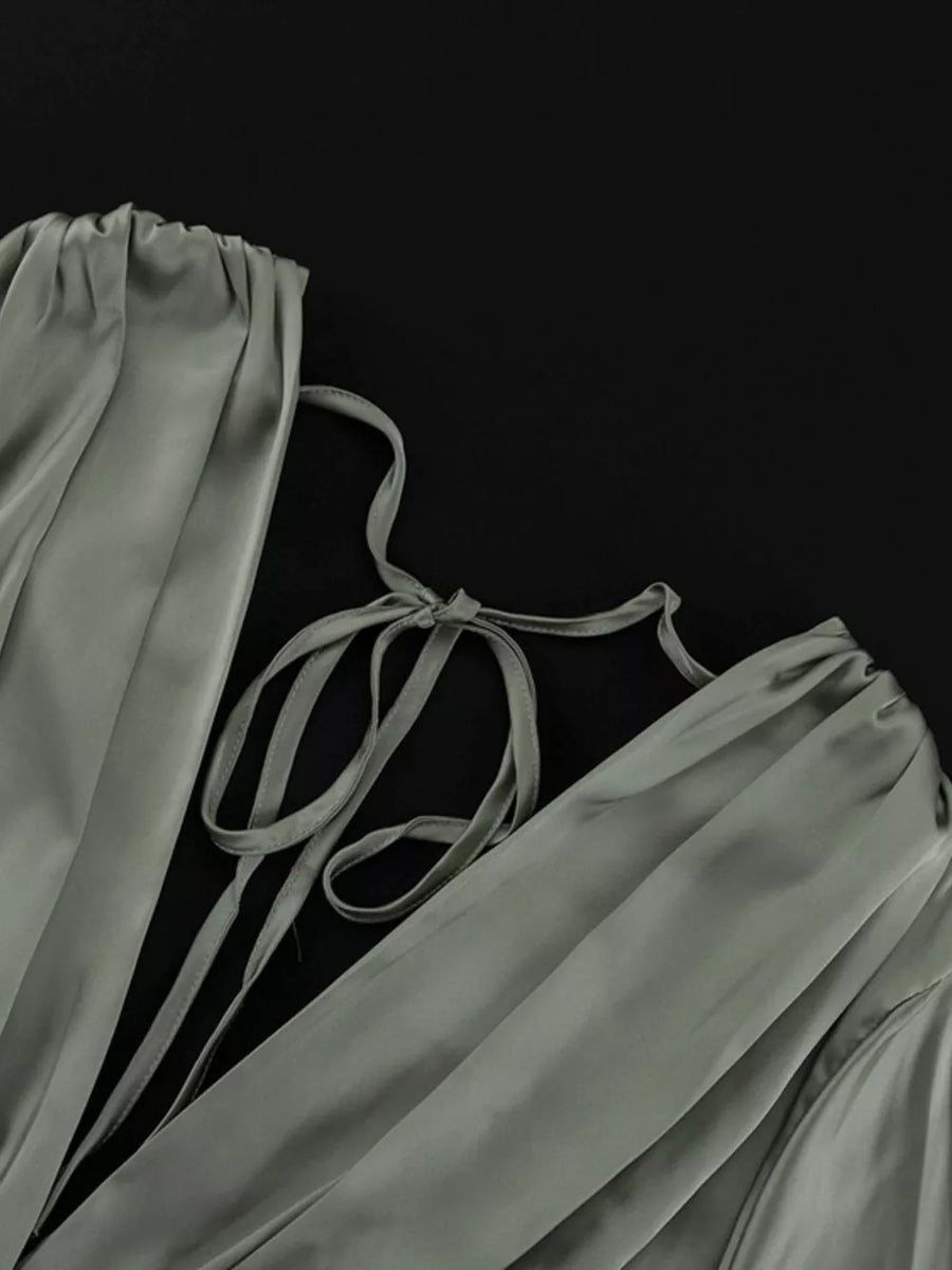 Sage green satin dress with tie-back detail and ruched neckline