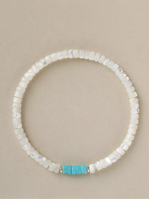 Turquoise,White mother-of-pearl Care instructions: 1 bracelet in Pastel Blue with beaded silhouette