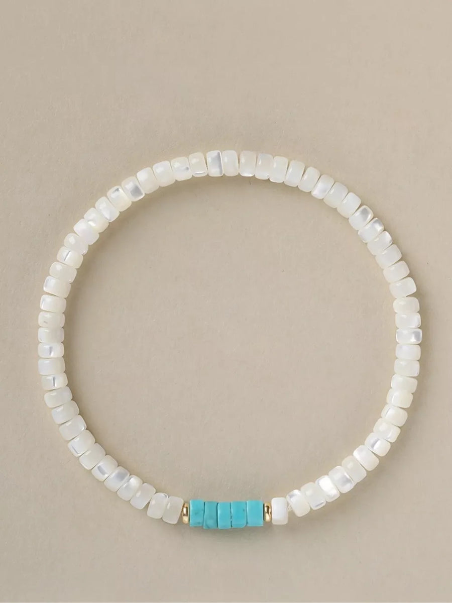 Turquoise,White mother-of-pearl Care instructions: 1 bracelet in Pastel Blue with beaded silhouette