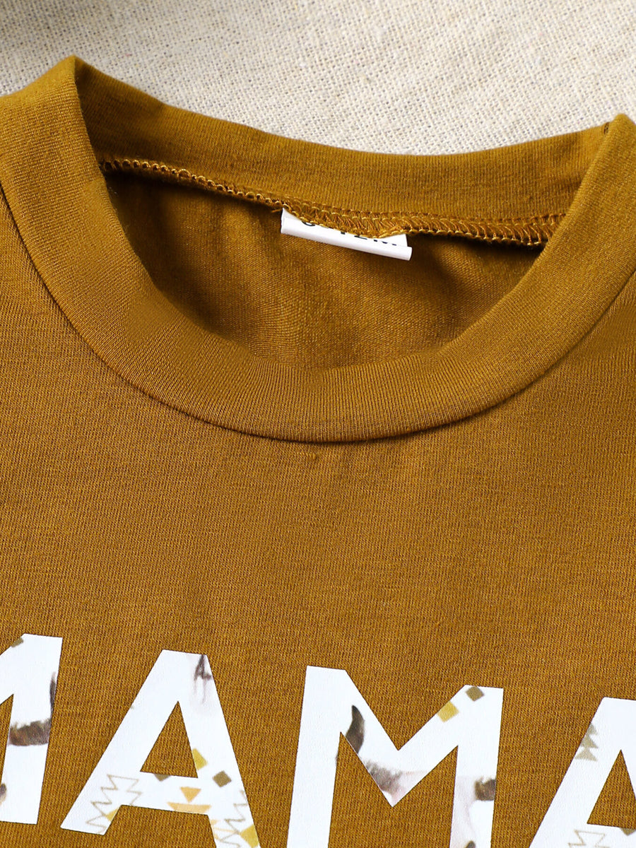 Caramel cotton blend graphic tee with "mama" text and tribal pattern detail.