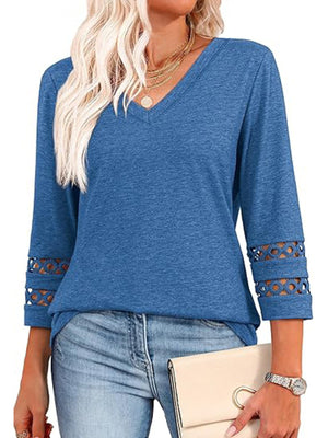 Blue 3/4 sleeve t-shirt with V-neck and cutout detail on sleeves.