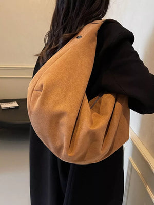 Spacious yellow brown suede shoulder bag with zipper pocket detail