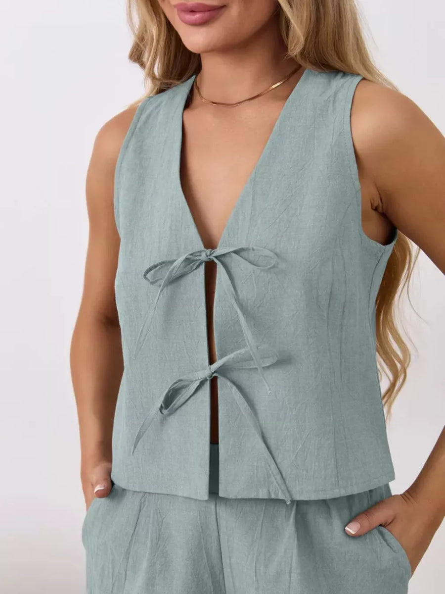 Blue cotton tie-front sleeveless top and shorts set with V-neckline.