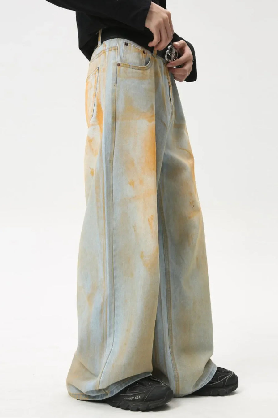 Acid wash palazzo denim jeans in light with orange tie-dye effect.