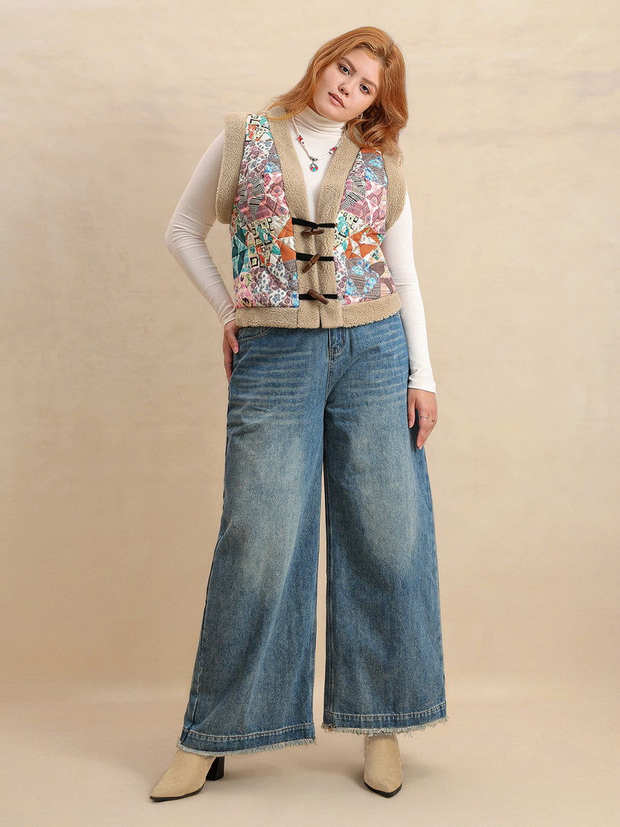 Patchwork sherpa toggle vest with multicolor geometric pattern and tan trim, worn open over a white turtleneck and wide leg