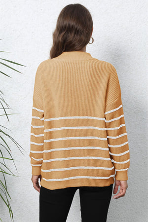 Tangerine ribbed knit sweater with white horizontal stripes and a quarter-zip neckline.