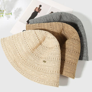 Ventilated knitted bucket hats in beige, tan, and gray with open weave detail.