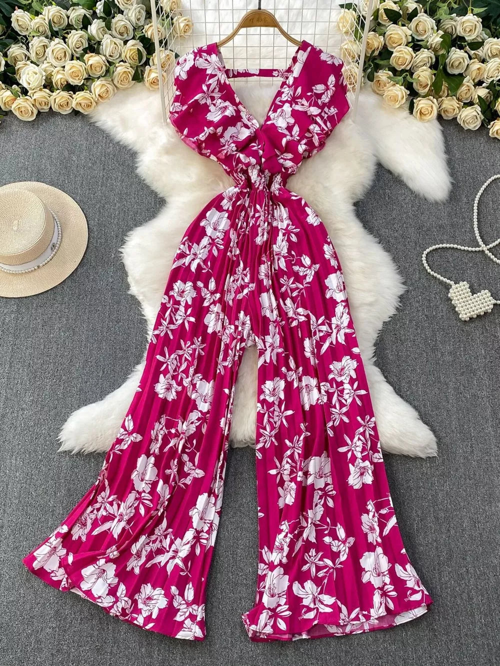 Rose Red floral pleated wide-leg romper with V-neck and wide sleeves.