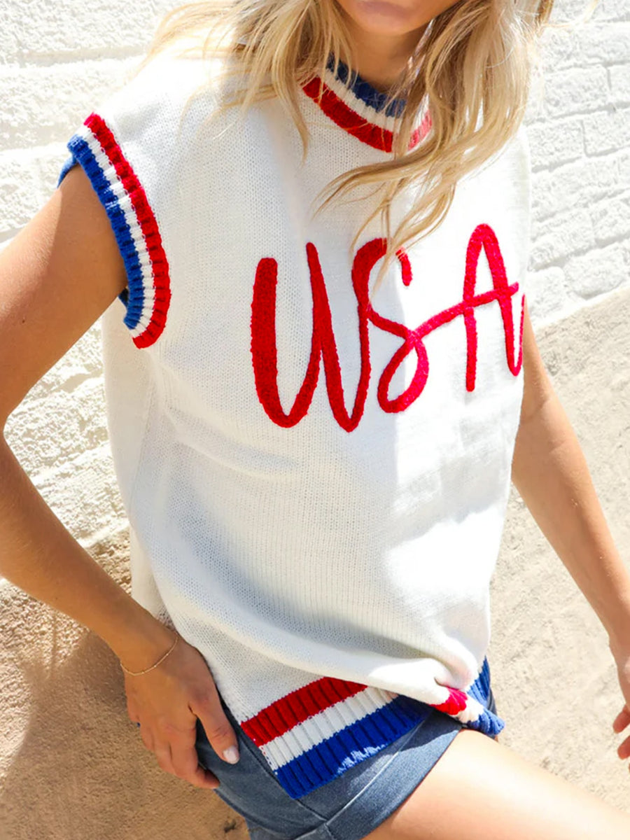 White knit sweater vest with red USA embroidery and red, white, blue striped trim.