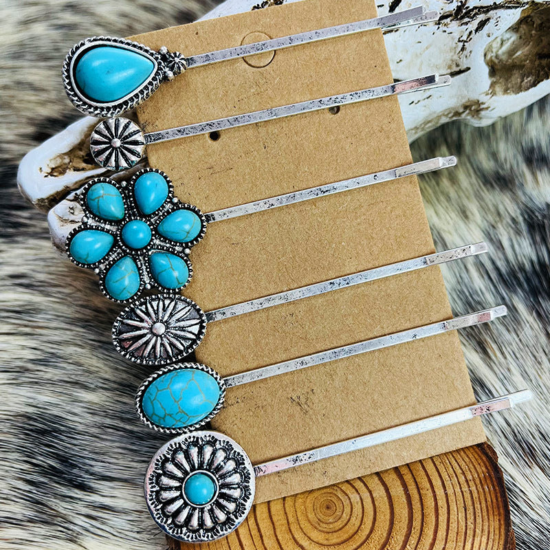 Turquoise blossom hair pins set with alloy metal and turquoise stones.