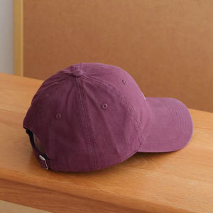 Raspberry purple cotton baseball cap with embroidered detail.