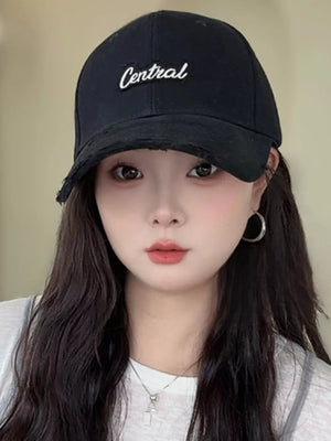 Black baseball cap with distressed brim and white "Central" embroidery