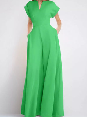 Neon green wide-leg romper with pockets and notched neckline.