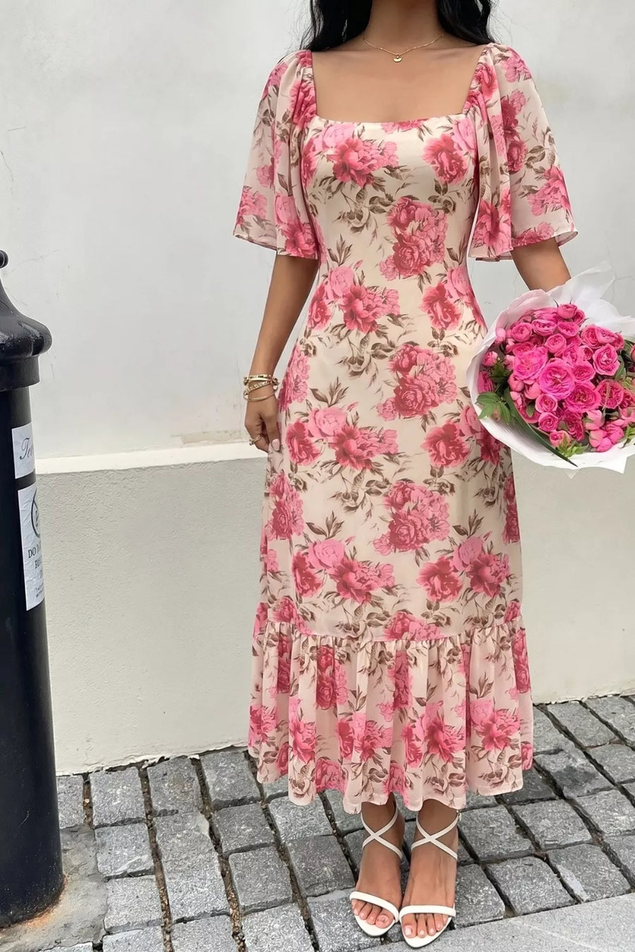 Floral midi dress with flutter sleeves, square neck, and tiered ruffle hem.