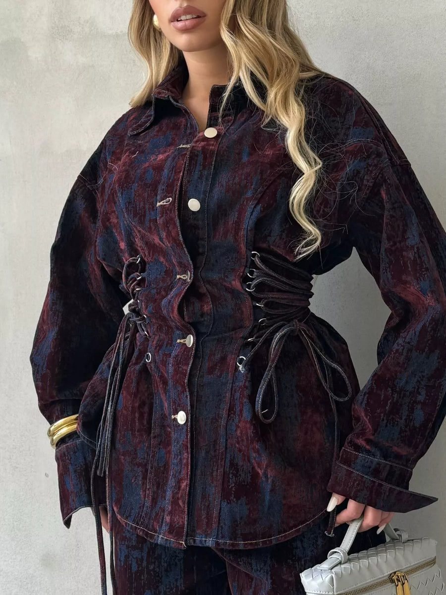 Burgundy denim jacket with lace-up corset detail and matching pants.