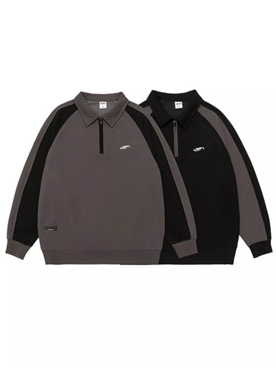 Plus-size raglan quarter zip sweatshirt in dark gray and black with contrast stitching and embroidered logo.