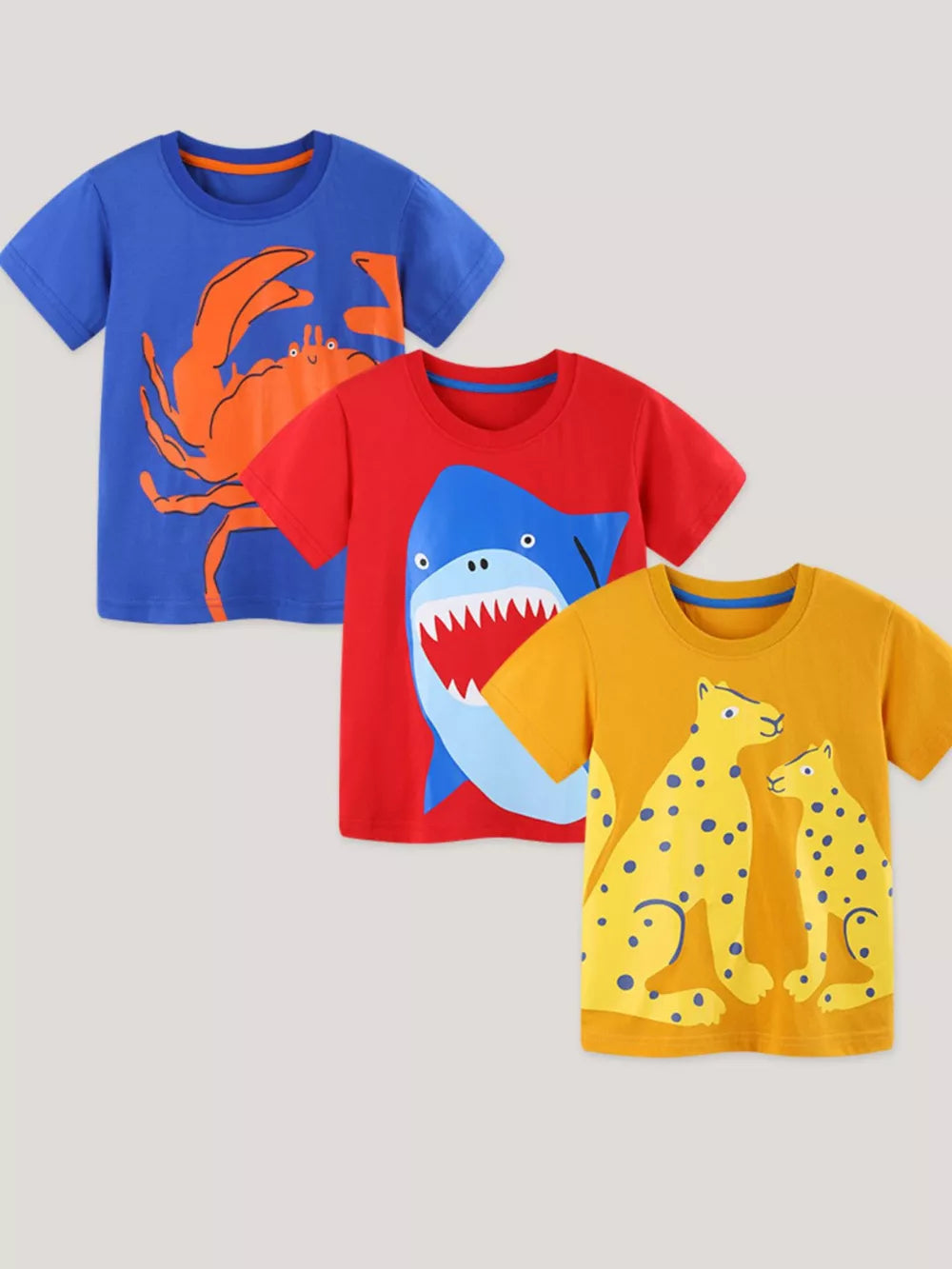 Kids' cotton crew neck t-shirts with animal prints: blue crab, red shark, yellow cheetahs.
