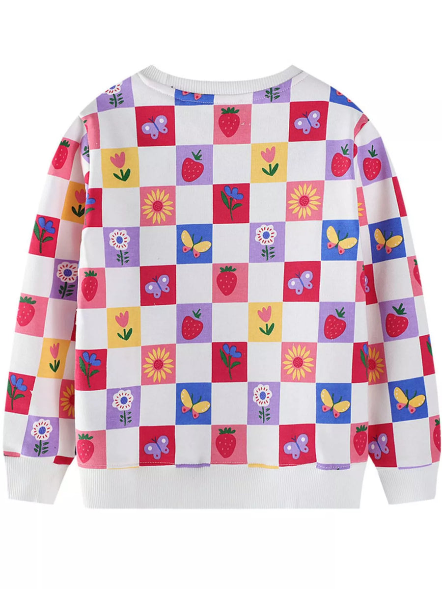 Baby sweatshirt with multicolor checkered pattern of strawberries, butterflies, and flowers.