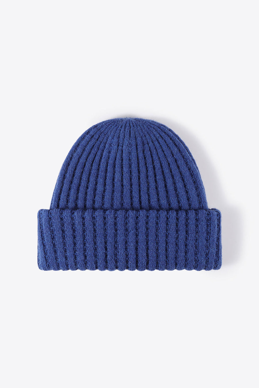 Textured ribbed knit beanie in Indigo acrylic with a cuffed hem.