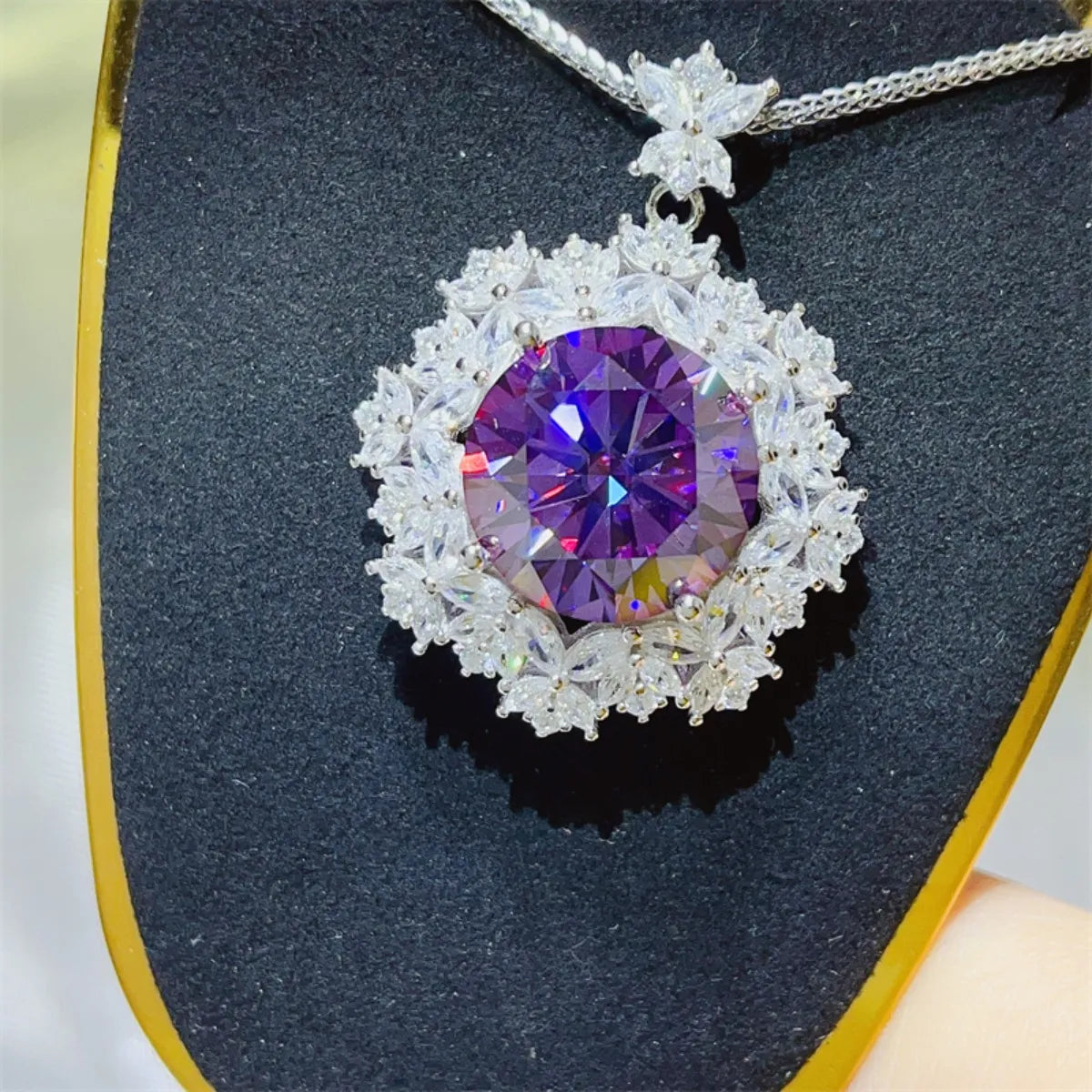 Amethyst pendant necklace with clear crystal halo and silver chain.