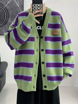 Oversized green striped V-neck cardigan with buttoned front and patch detail.