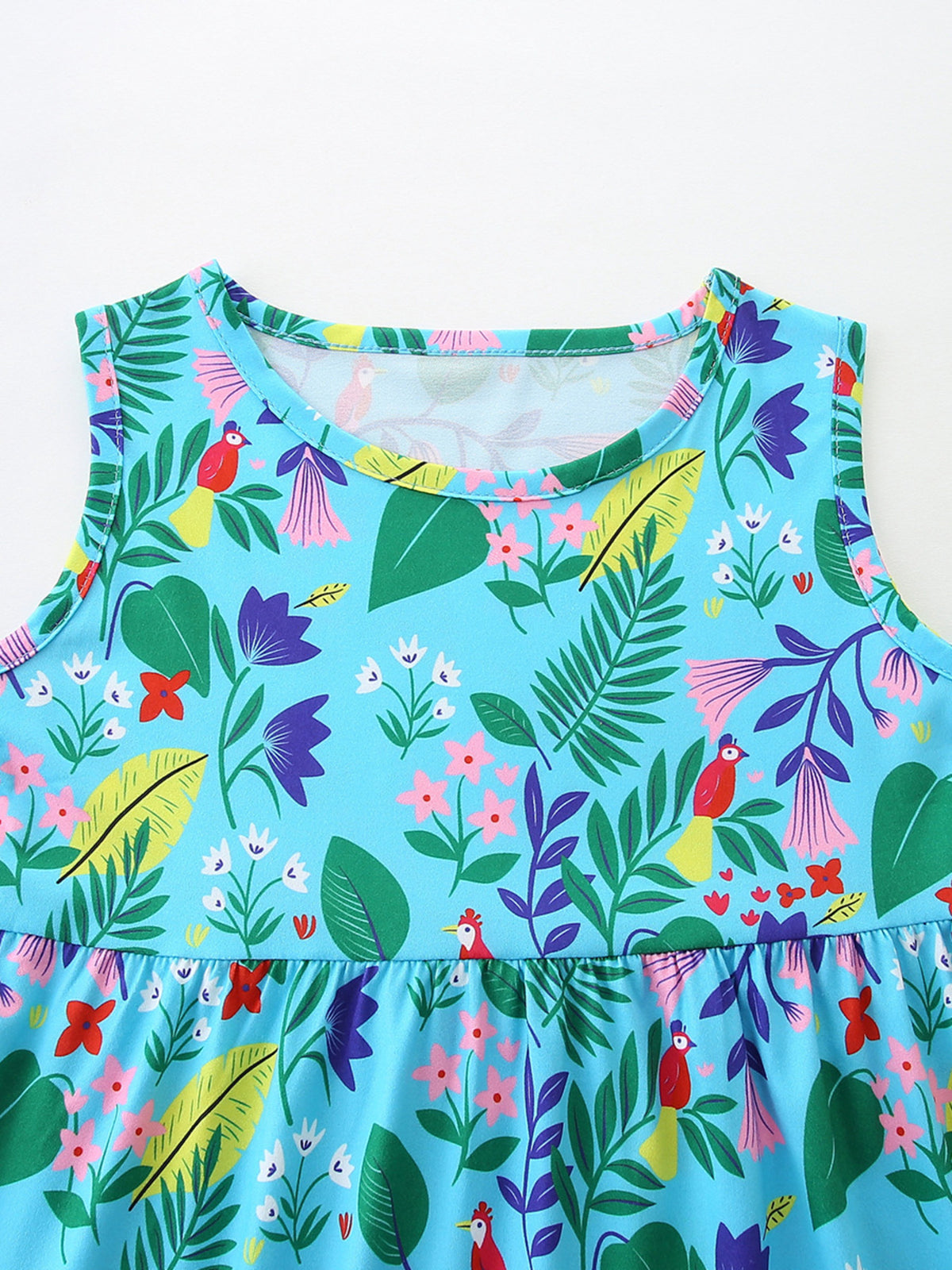 Toddler sleeveless dress with tropical floral and bird print, round neck, peplum hem.