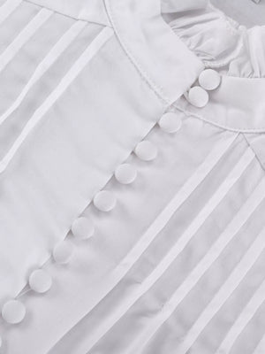White pintuck blouse with ruffled collar and fabric-covered buttons