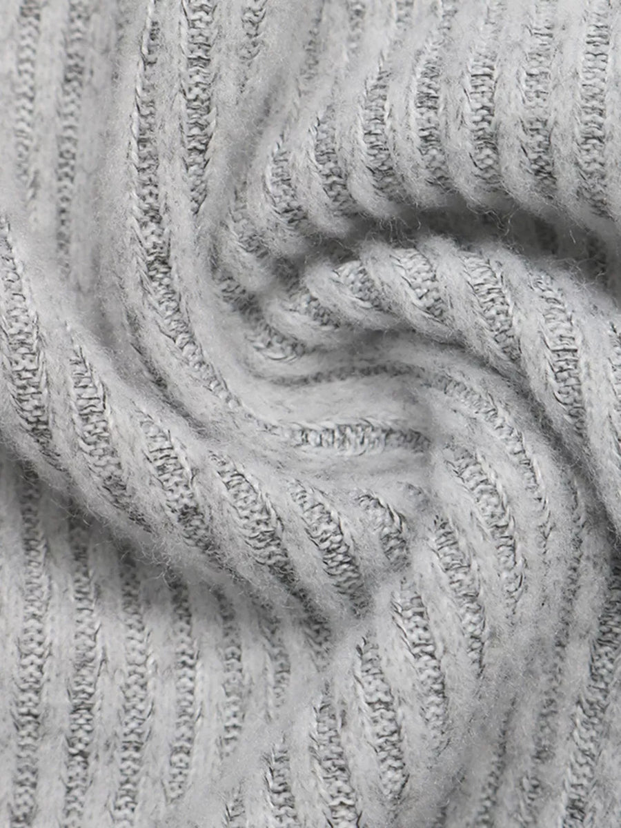 Grey ribbed knit fabric with a soft, fuzzy texture.