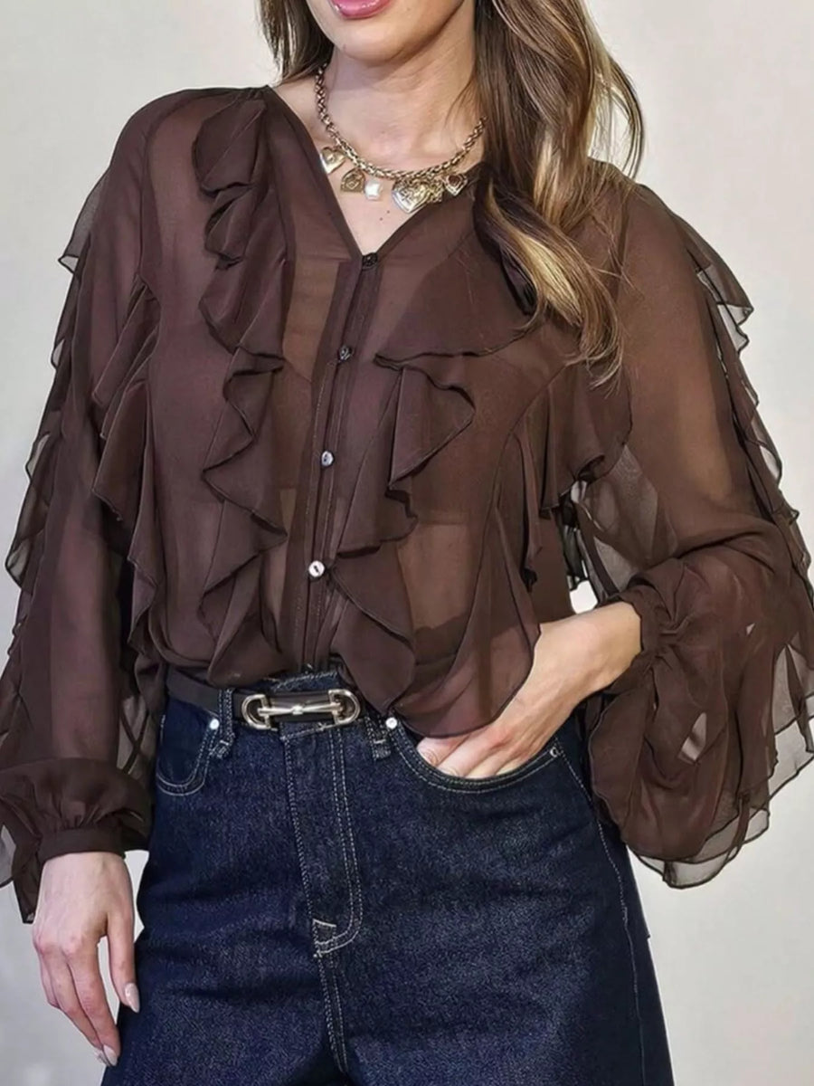 Brown sheer long-sleeve blouse with ruffled details and button front.