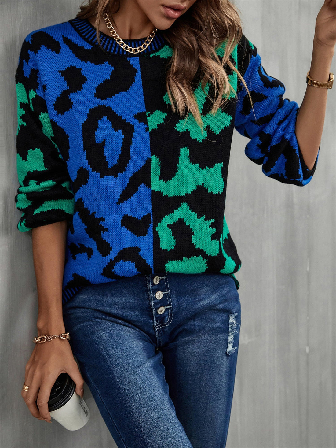 Split leopard knit sweater in blue/green with statement sleeves and crew neck.