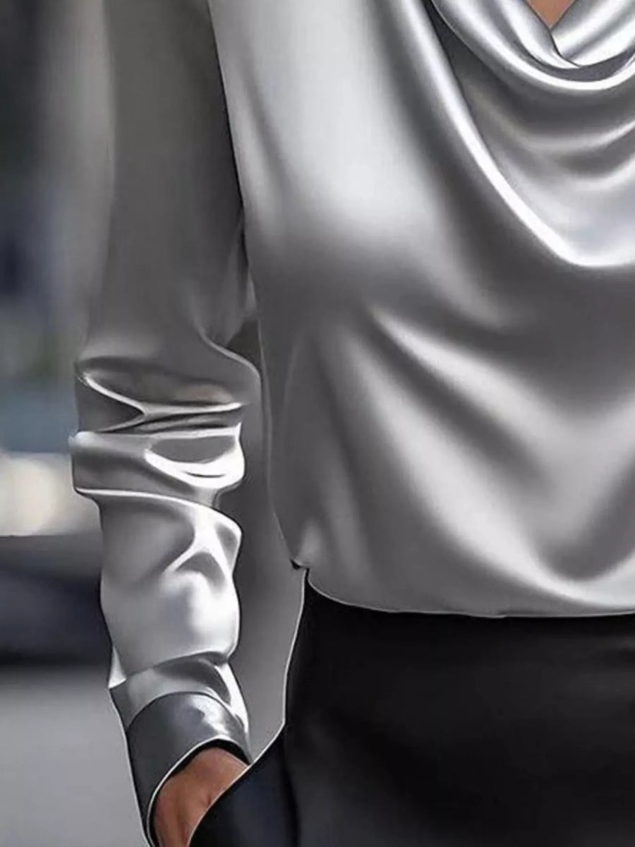 Gray satin cowl neck long-sleeve blouse with draped neckline and ruched sleeve detail.