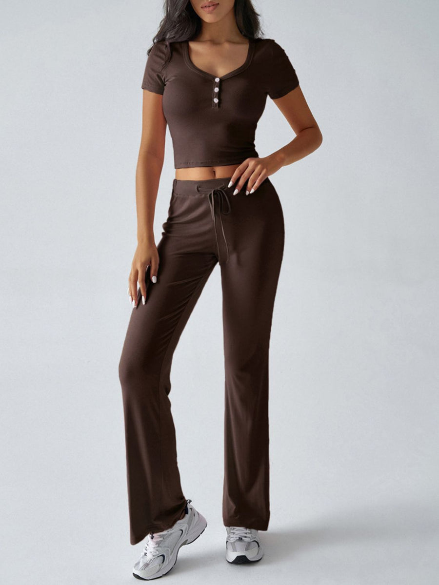 Brown button-front crop top and flared lounge pants with drawstring waist.