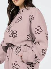 Dusty pink cropped lounge set with black drawn floral print, crewneck sweatshirt and drawstring pants.