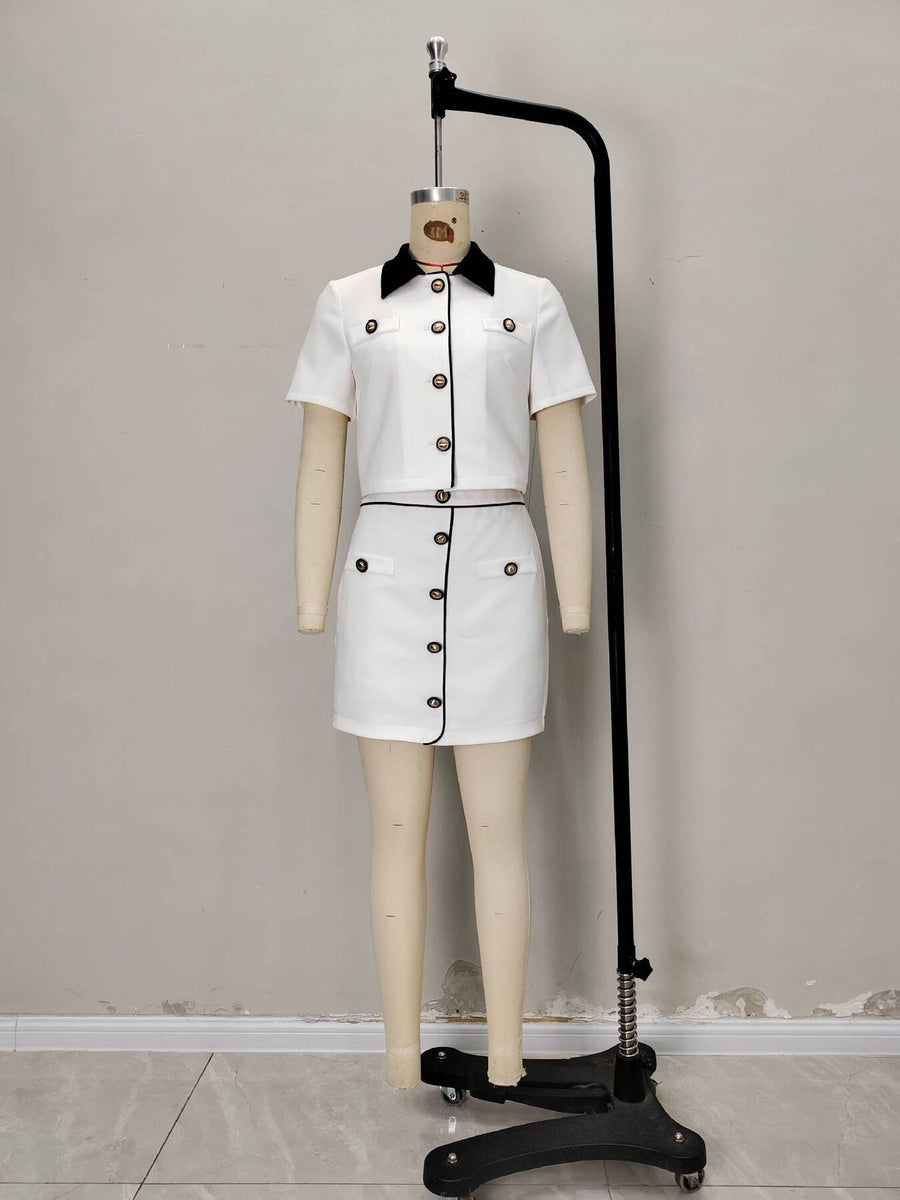 95% polyester, 5% spandex Care instructions: Machine wash cold two-piece set in White with fitted silhouette