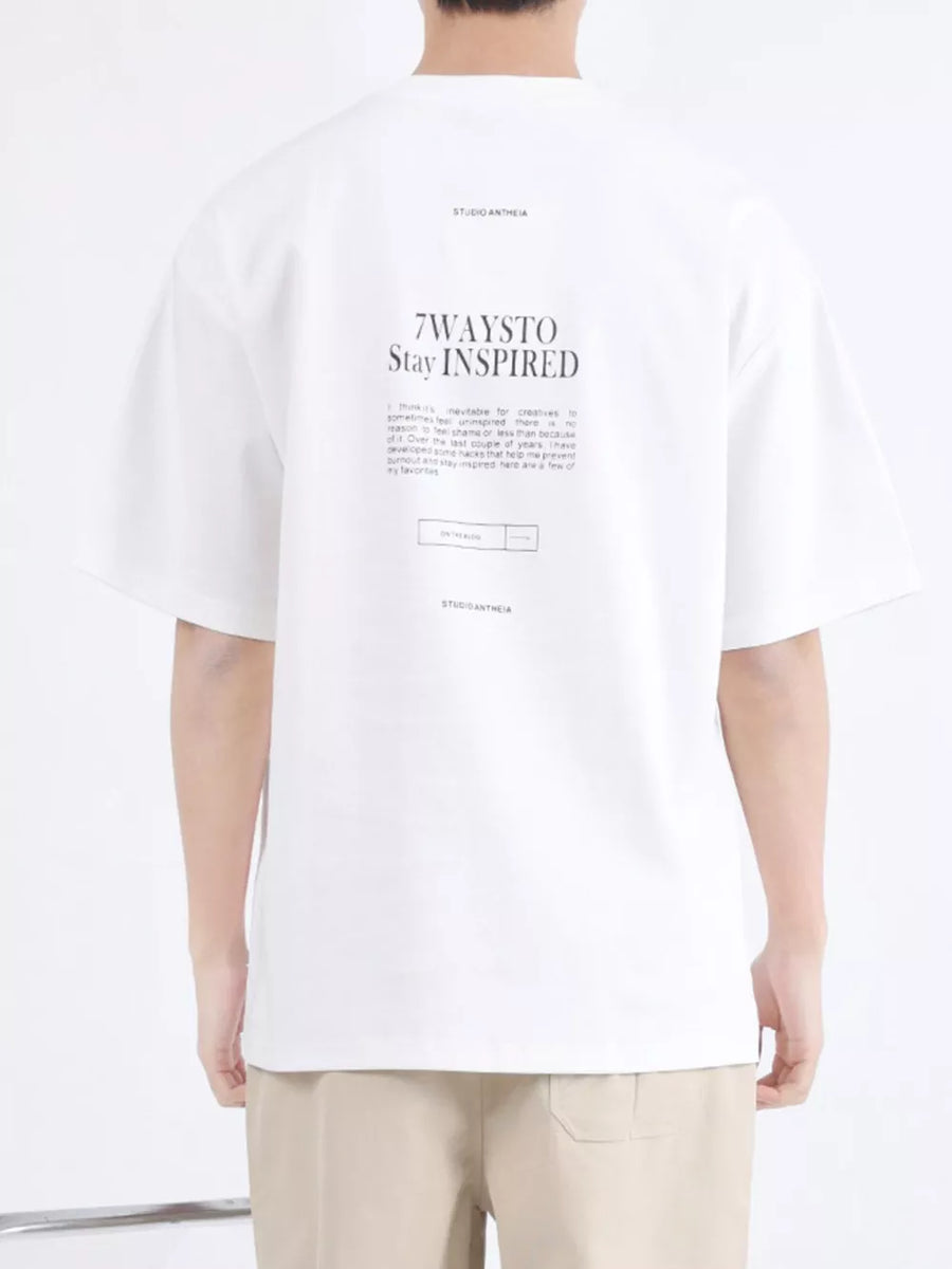 White cotton blend crew neck t-shirt with graphic text print on back