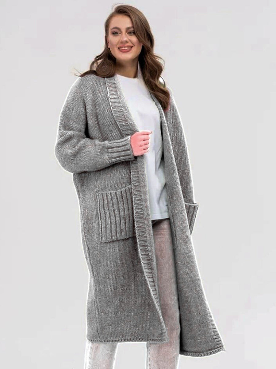 Gray oversized knit cocoon cardigan with pockets and ribbed cuffs.
