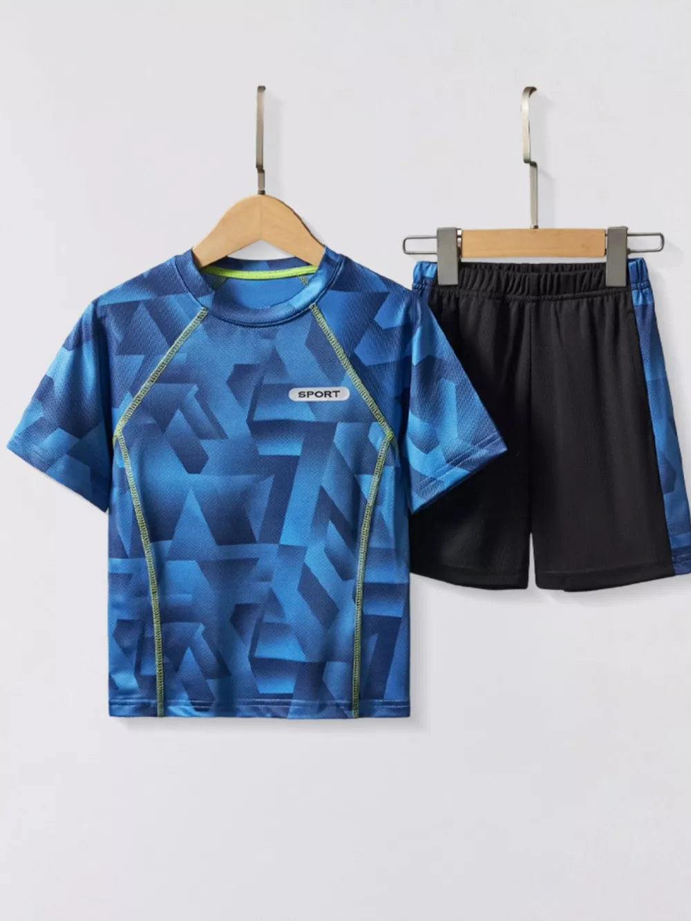 Boys' blue geometric print sport set with black shorts.