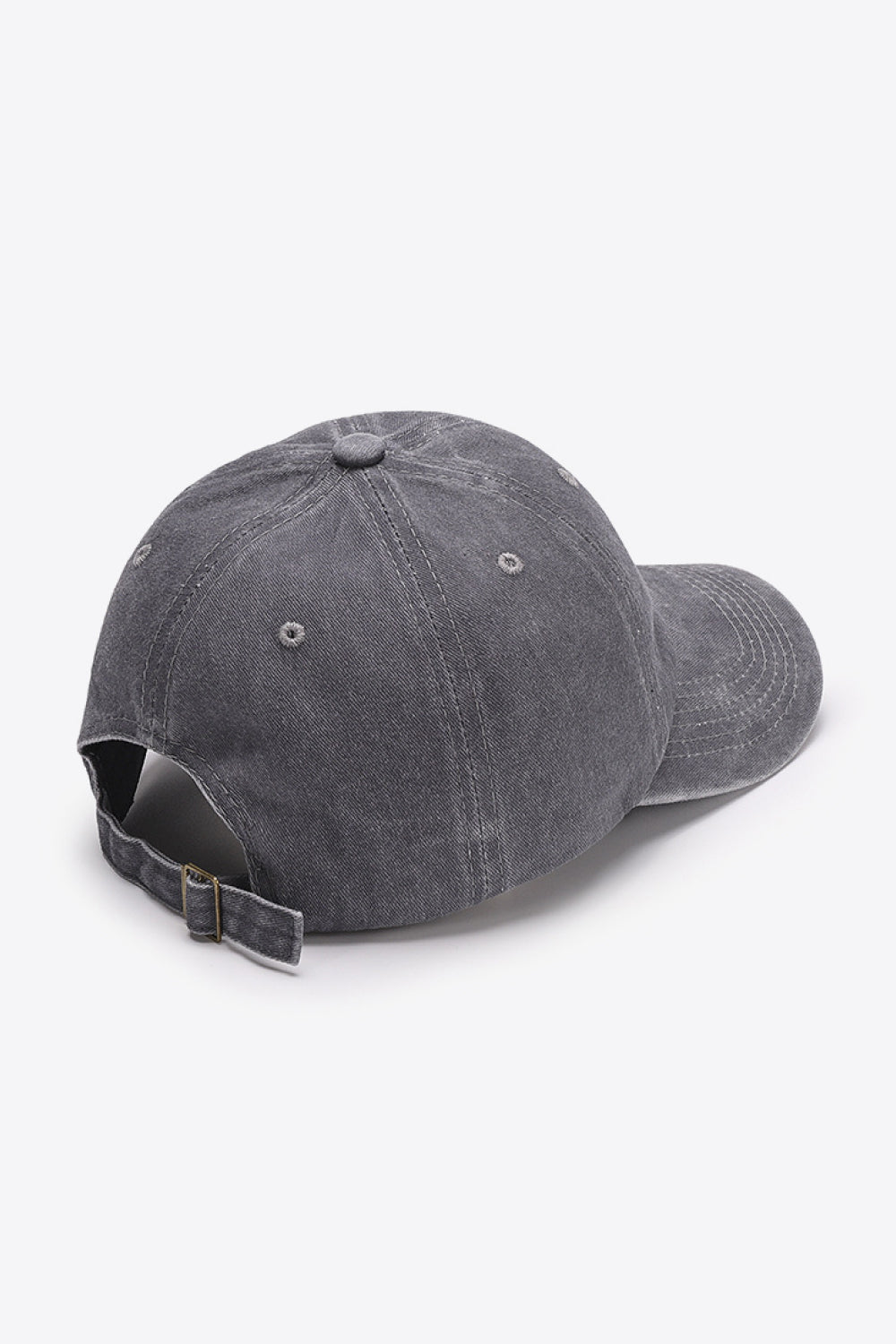 Washed cotton baseball cap in gray with adjustable strap and metal buckle.