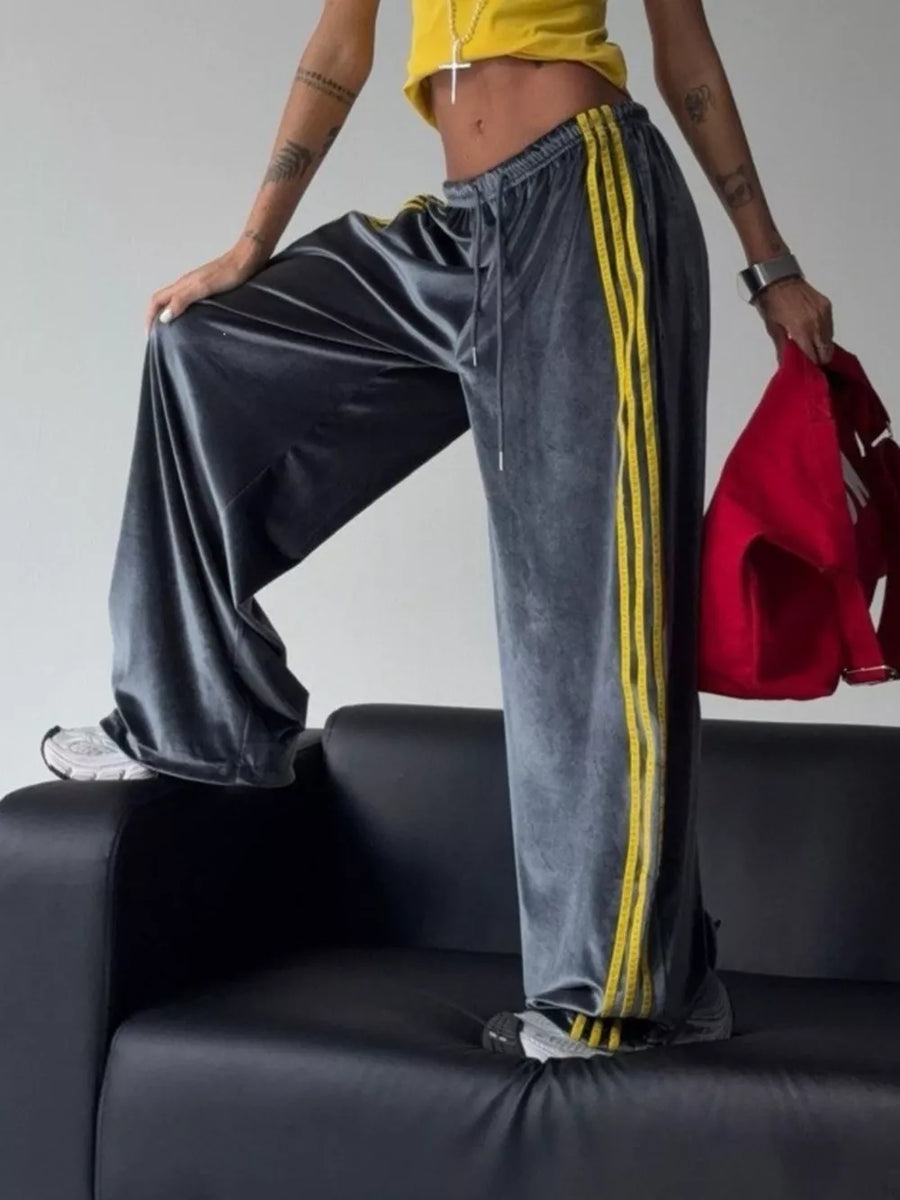Blue wide-leg pants featuring contrast stitching and striped