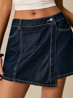 Dark blue cotton skort with contrast stitching and button closure.