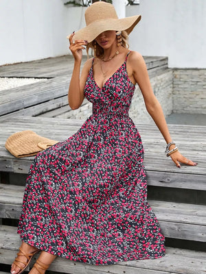 Maxi dress with floral print, V-neck, spaghetti straps, and smocked waist.