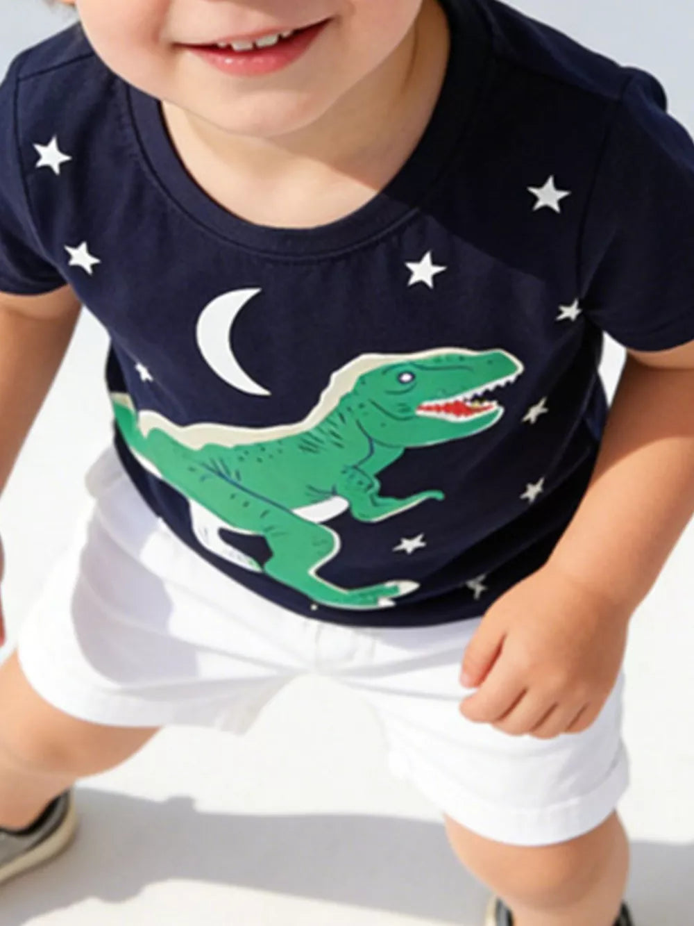 Navy cotton crew neck t-shirt with green dinosaur, moon, and star print